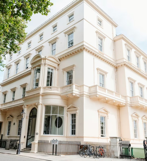 Exterior of luxurious white building in London.